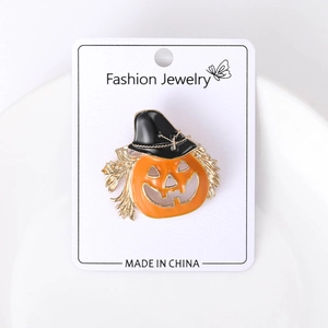Detailed view of Halloween pumpkin brooch with wizard hat and glossy enamel finish