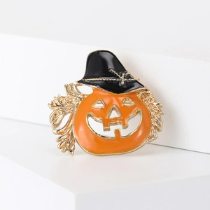 Halloween pumpkin brooch with wizard hat and orange enamel on a white geometric stand