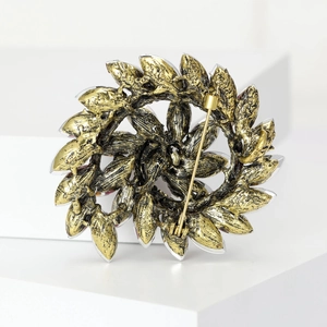Retro floral wreath brooch in vintage gold finish with secure pin back and textured detail