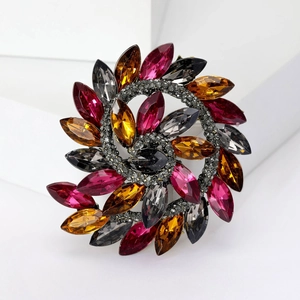 Vintage style floral spiral brooch with colorful marquise crystals and grey rhinestones