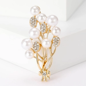 Elegant floral pearl brooch with sparkling rhinestones on golden alloy bouquet base