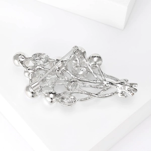 Detail view of the silver flower brooch back showing sturdy alloy pin clasp mechanism