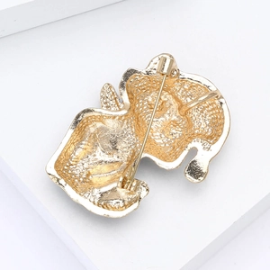Close-up of the metal back and safety pin fastener of the cute cat enamel brooch