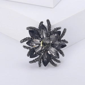 Elegant dark grey floral brooch featuring marquise crystal petals and gunmetal finish