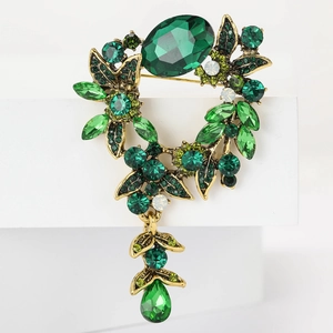 Broche panier dorée vintage avec cristaux émeraude et pendentifs floraux en strass