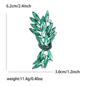 Luxury green leaf crystal brooch in emerald tones with vintage bronze finish