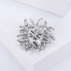 Detailed back view of flower brooch showing the secure metal pin clasp and craftsmanship