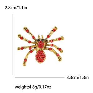Creative spider brooch in golden alloy with red rhinestones and green gem eyes