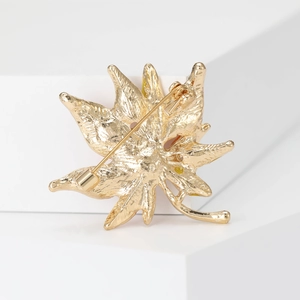 Golden maple leaf brooch for women featuring detailed metal texture and pin back structure