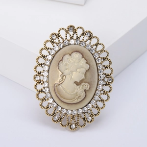 Vintage gold cameo brooch with lady silhouette, hollow lace metal frame and rhinestones