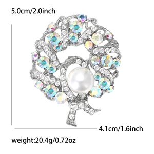 Detail view of round wreath brooch with diamonds and pearls showing size 5.0cm by 4.1cm