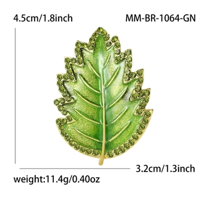 Elegant green enamel leaf brooch with rhinestones in gold finish, 4.5cm height