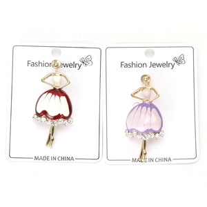 Detail of ballet girl brooches with enamel skirts and sparkling crystals on card