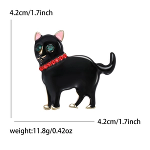 Détail de broche chat noir avec yeux en strass vert et dimensions affichées