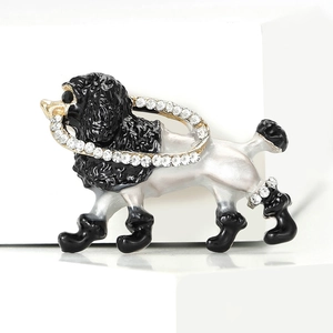 Elegant poodle dog enamel brooch with sparkling rhinestones on a white pedestal