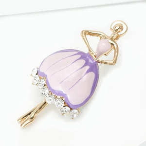 Detailed close-up of dancing ballet girl brooch with purple enamel and sparkling crystals