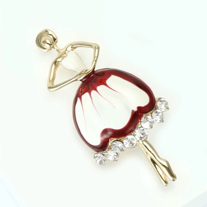 Detail of enamel ballerina brooch with red and white dress and sparkling rhinestones
