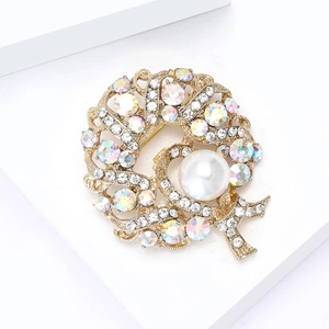 Elegant gold wreath brooch featuring crystal rhinestones and a large white center pearl
