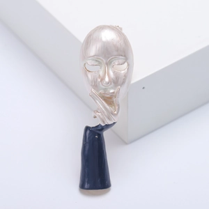 Broche artístico de máscara de pensador con esmalte azul y acabado plateado en base blanca