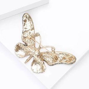 Exquisite gold-plated alloy butterfly brooch with detailed textured back and secure pin