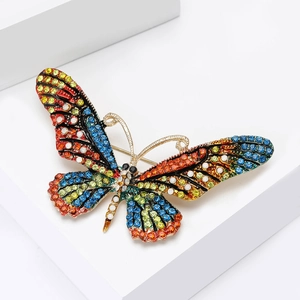 Detailed 45-degree angle of a luxury butterfly brooch with colorful crystal rhinestones