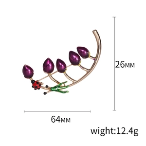 Golden alloy floral brooch with purple enamel buds and red ladybug beetle accent