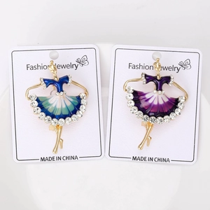 Detail of ballet dancer brooches with enamel gradient skirts and sparkling rhinestones