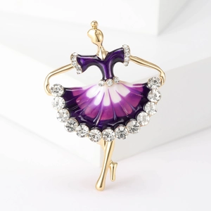 Macro detail of dancing ballerina brooch with purple enamel dress and sparkling crystals