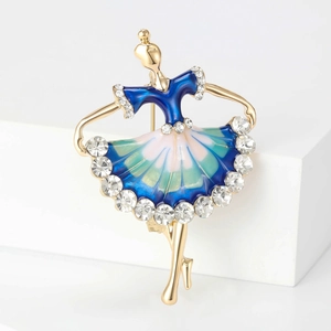 Detailed close-up of ballerina brooch with colorful enamel and sparkling crystals