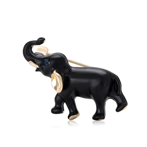 Spilla a elefante in smalto nero con accenti dorati e occhio con pietra preziosa blu