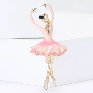 Elegant ballet dancer brooch with pink enamel skirt and golden finish on white display