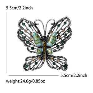 Close-up of vintage butterfly brooch with dimensions 5.5cm by 5.5cm and 24g weight