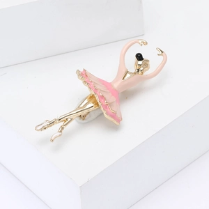 Elegant ballet dancer brooch with pink enamel and gold-plated alloy in a jumping pose
