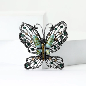 Vintage butterfly brooch in silver with green and amber crystals for elegant women