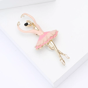Close-up of elegant pink enamel ballet dancer brooch on minimalist white stand