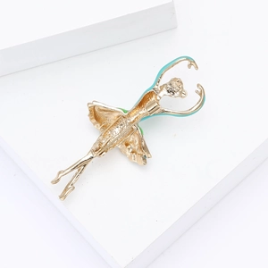 Detail of ballet dancer brooch with gold-tone alloy and blue enamel finish