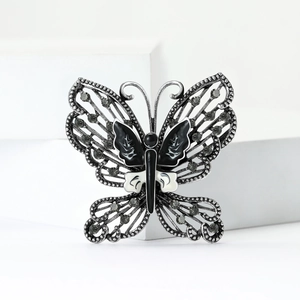 Retro butterfly brooch with silver alloy, black and white enamel, and grey rhinestones