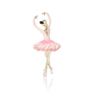 Elegant gold-tone ballet dancer brooch with pink enamel skirt on white background