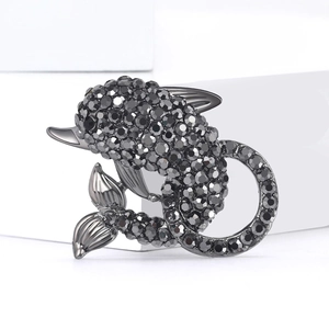 Exquisite gunmetal dolphin brooch with micro-paved grey rhinestones on white display