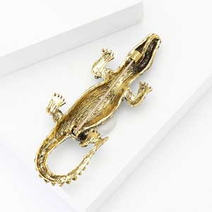 Detailed back view of vintage crocodile brooch showing secure pin clasp and bronze alloy