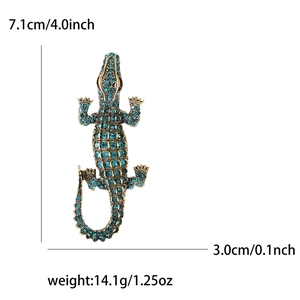 Crocodile brooch pin with blue crystals and gold alloy finish for suits, 7.1cm length