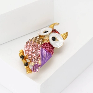 Exquisite owl brooch with pink crystals and purple enamel on a gold alloy base