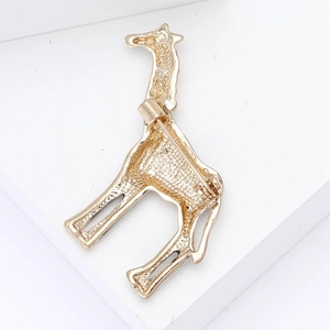 Detailed back view of giraffe brooch showing secure safety pin and textured gold alloy
