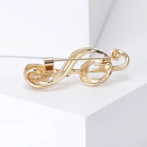 Elegant gold treble clef music note brooch pin with polished finish for fashion accessory