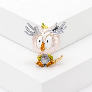 Cartoon owl brooch with white enamel finish on silver branch stand for women
