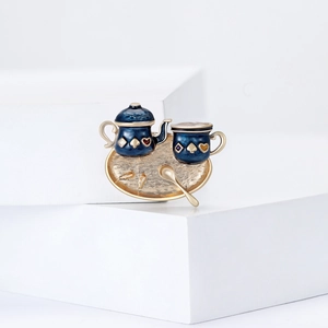 Whimsical tea set enamel brooch with teapot and cup on a golden tray for women