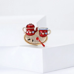 Cute enamel tea set brooch pin featuring a red teapot and gold tray for unisex outfits