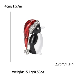 Cute Christmas penguin brooch pin with red rhinestone hat and enamel finish