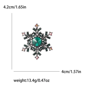 Vintage snowflake brooch with green gems and rainbow rhinestones, size 4.2cm x 4.0cm