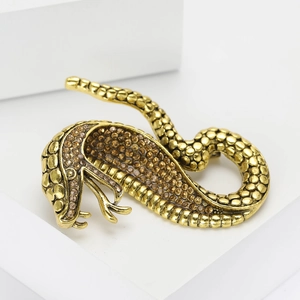 Exquisite golden cobra snake brooch set with amber rhinestones and scale texture